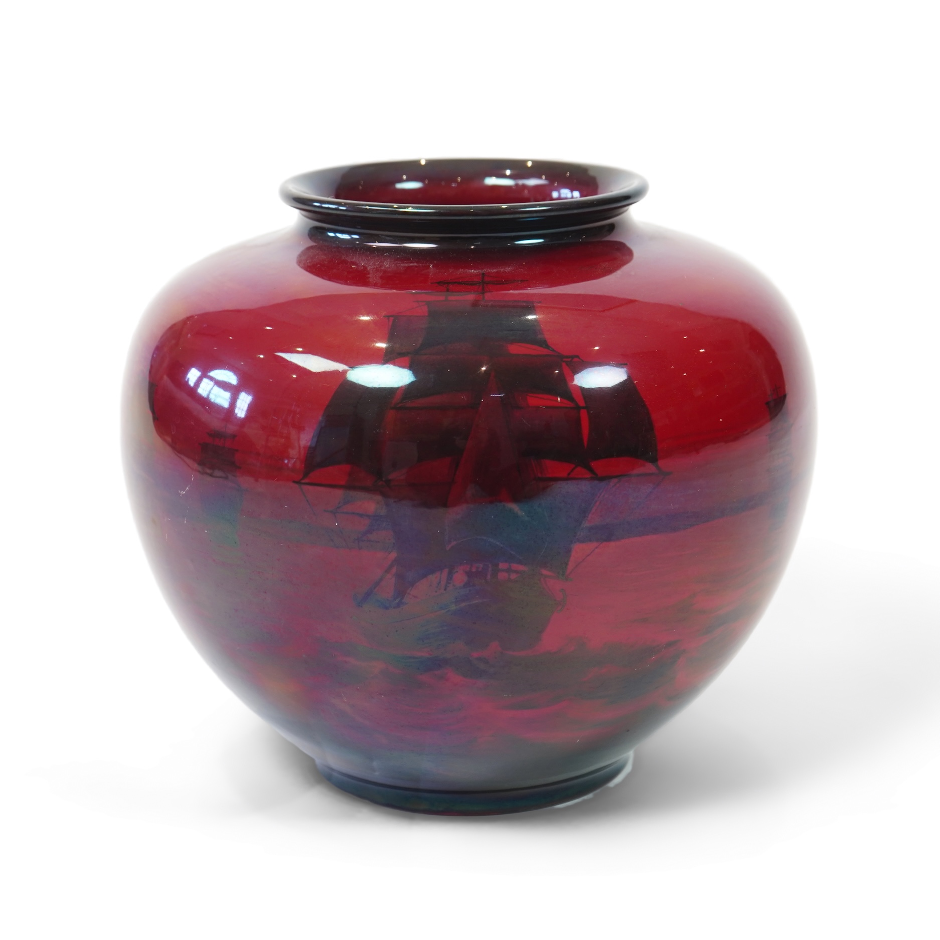 A large Doulton flambe vase decorated with ships, 29cm high